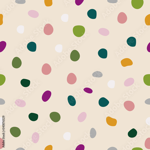 Vector seamless pattern with spots. Cream background.