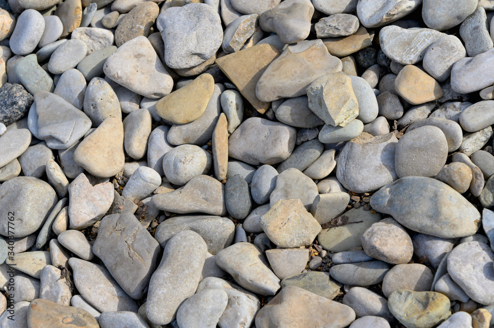 Natural pebble background. Gray pebbles close-up. Natural pebble background. Gray pebbles close-up.