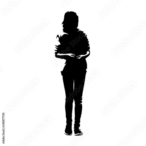 Young schooler girl standing with arm in arm, ink drawing isolated vector silhouette