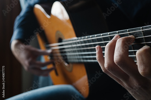 guitarist. Man playing acoustic guitar