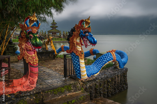 Bedugul, Lake Beratan, Tabanan, Bali, Indonesia - March 21, 2019 : The mystical dragons at Ulun Danau Beratan temple on a cloudy and rainy morning