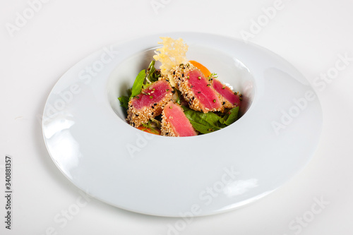 Dishes in white plates on a white background with the application of food design.