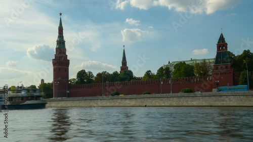 Timelapse. Ships pass along the Moscow River against the backdrop of the Moscow Kremlin.