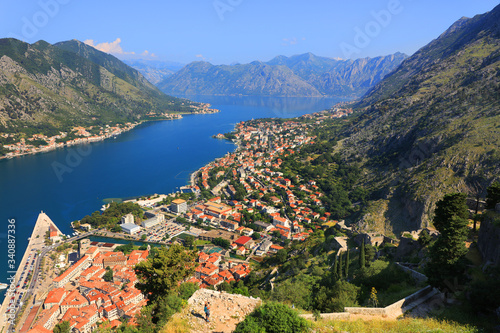 Aerial beautiful View of Kotor bay. Cruise ship docked in beautiful summer day. View of kotor old town from Lovcen mountain in Kotor, Montenegro. Kotor is part of the unesco world.