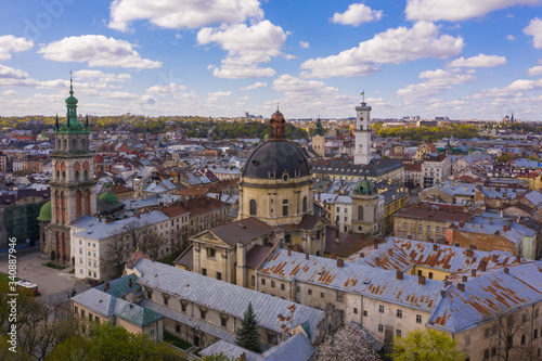 Aerial view on Dominican Church, Dormition Church and City Hall in Lviv, Ukraine from drone