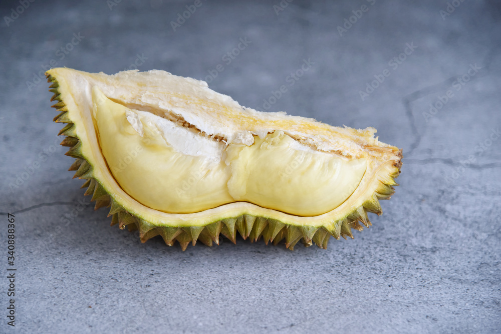 Durian riped. King of Fruits. Durian is a popular tropical fruit in Thailand. Betel of durian with durian peel on Dark color background. Seasonal fruit concept. Selected focus. Durian riped. King of Fruits. Durian is a popular tropical fruit in Thailand. Betel of durian with durian peel on Dark color background. Seasonal fruit concept. Selected focus.