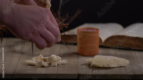 	Cup being filled with wine and Bread being ripped with Crown of Thorns, Bible