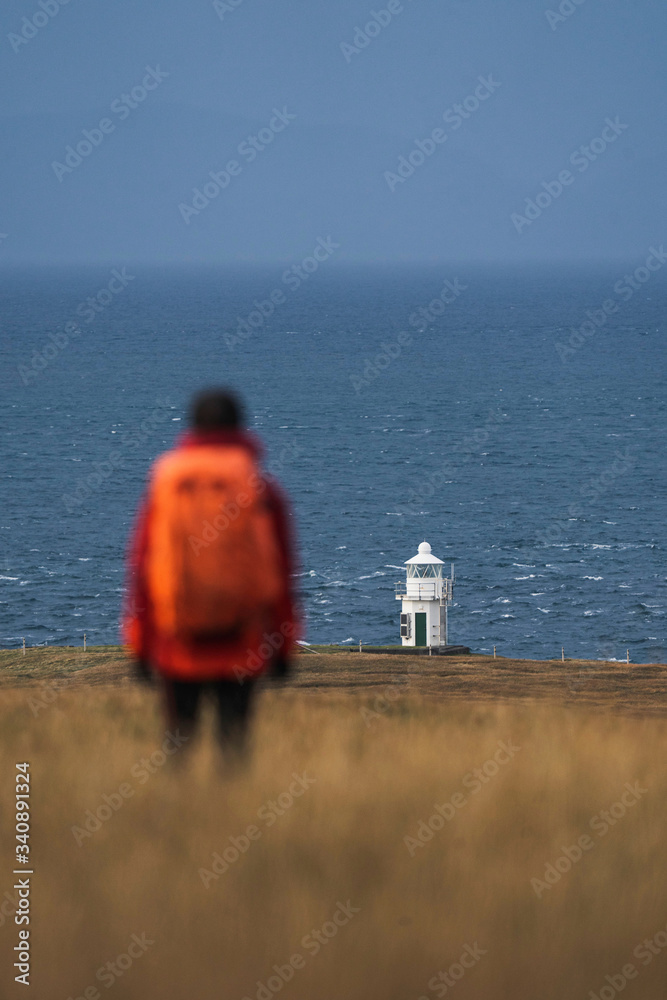 Fototapeta premium Traveler at Vaternish Lighthouse