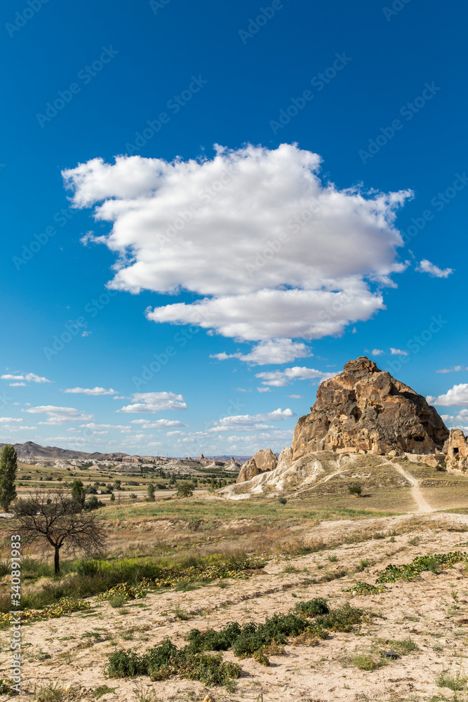 mountain landscape with blue sky and clouds, Cappadocia, Turkey.
