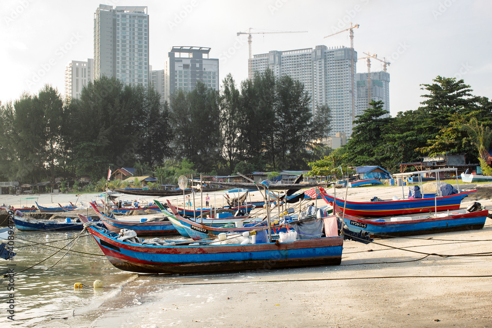 Timber fishing boats moored on the beach Penang