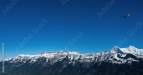 snow mountian blue sky parachute