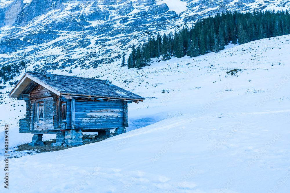 Winter landscape with snow covered peaks on Kleine Scheidegg mountain in Swiss Alps near Grindelwald, Switzerland