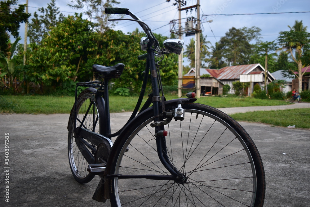 Fototapeta premium old bicycle in the village