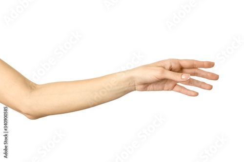 Reaching hand. Woman hand gesturing isolated on white