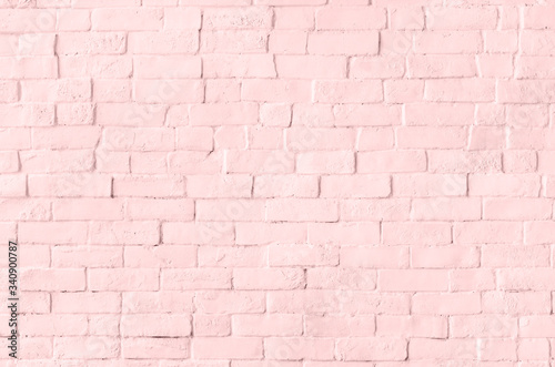 Pastel pink brick wall textured background