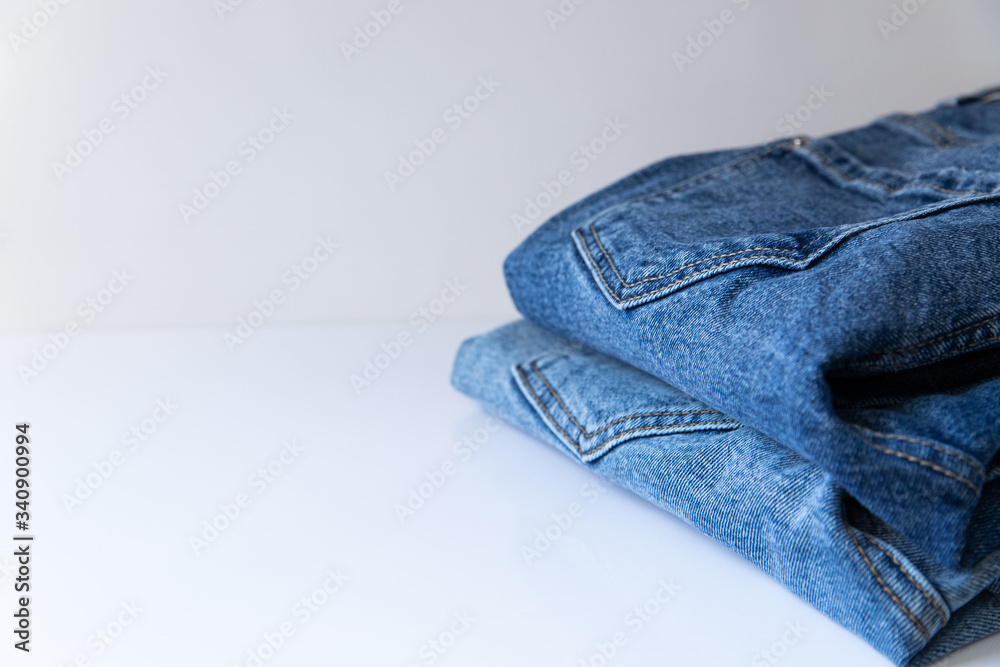 Modern blue jeans on white background Modern blue jeans on white background