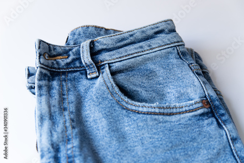 Modern blue jeans on white background