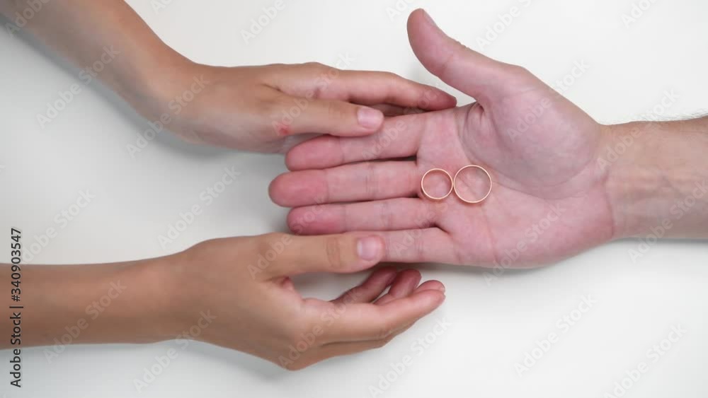 The man makes an offer, palms and wedding rings close-up. The man makes an offer, palms and wedding rings close-up.