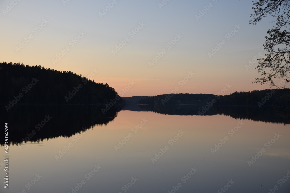 sunset over still lake in europe