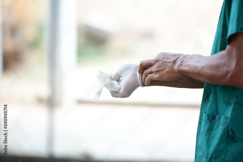 hands of a man cleaning the window