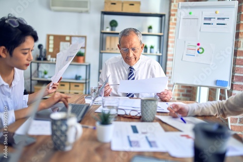 Group of business workers working together at the office