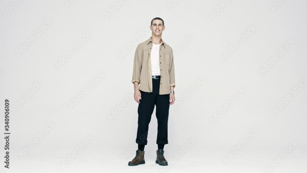 Full length of a happy young caucasian man looking at camera. Stylish man standing on white background and smiling.
Full length of a happy young caucasian man looking at camera. Stylish man standing on white background and smiling.