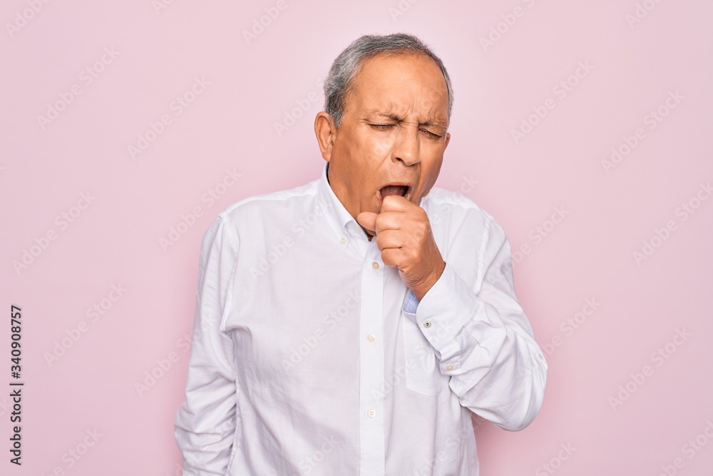 Senior handsome grey-haired man wearing elegant shirt over isolated pink background feeling unwell and coughing as symptom for cold or bronchitis. Health care concept. Senior handsome grey-haired man wearing elegant shirt over isolated pink background feeling unwell and coughing as symptom for cold or bronchitis. Health care concept.
