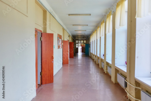An empty school corridor stretching into the future. The concept of holidays, quarantine, evacuation