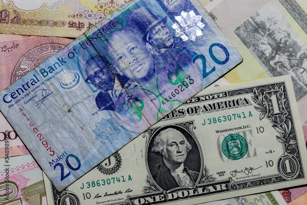 Obraz premium One US Dollar with Different Lesotho loti Banknotes