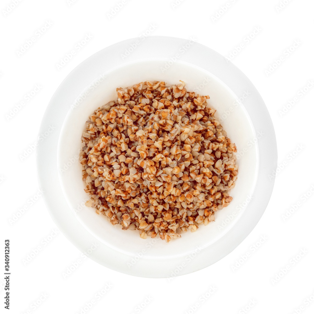 Deep white plate on a saucer with boiled buckwheat. Deep white plate on a saucer with boiled buckwheat.