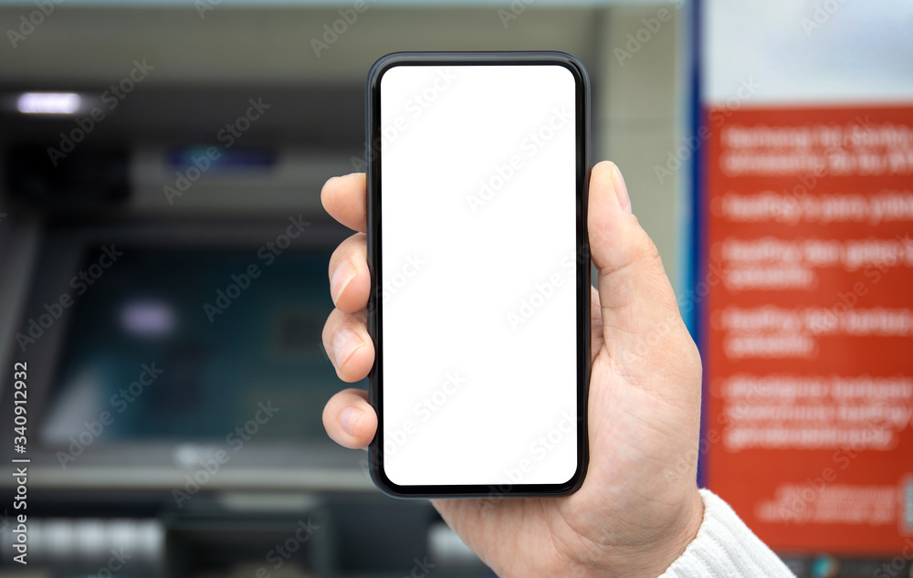 male hand holds phone with isolated screen background of ATM male hand holds phone with isolated screen background of ATM