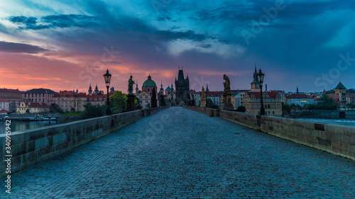 View of Charles Bridge in Prague during sunset, Czech Republic. The world famous Prague landmark.