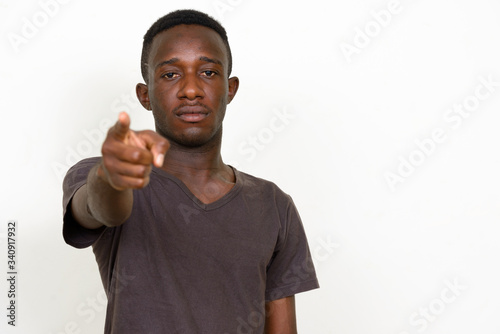Portrait of young African man pointing at camera