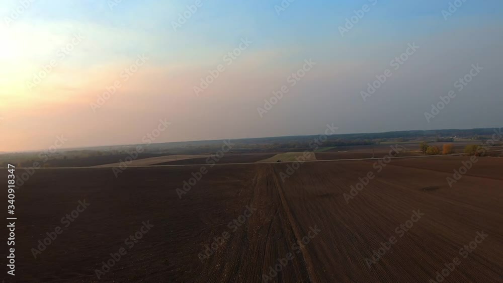 FPV aerial proximity flying above farm lands in countryside. Authentic creative shot on fpv racing drone FPV aerial proximity flying above farm lands in countryside. Authentic creative shot on fpv racing drone