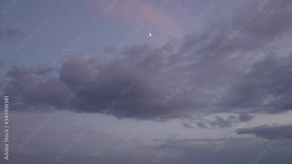 Aerial view of the moon with a tilt down to small town. Aerial view of the moon with a tilt down to small town.
