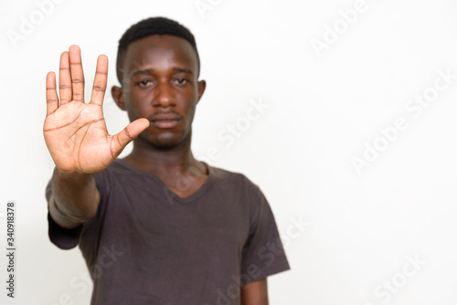 Portrait of young African man with stop sign © Ranta Images