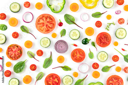 Fresh summer vegetables, a flat lay on a white background, vibrant food pattern, overhead shot
