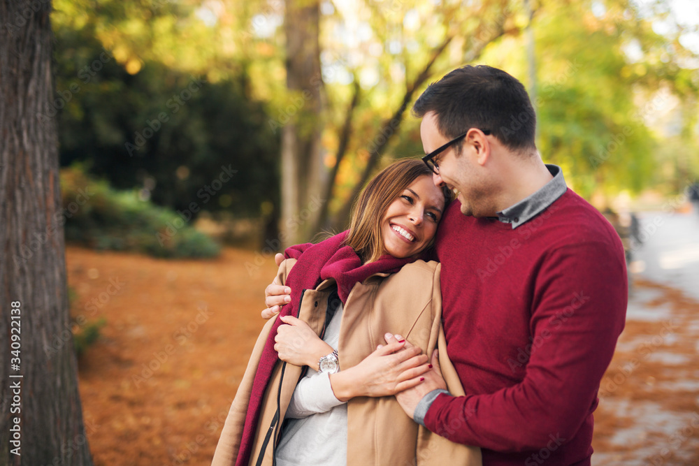 © Jelena - Beautiful couple hugging while enjoying autumn in the park. © Jelena - Beautiful couple hugging while enjoying autumn in the park.