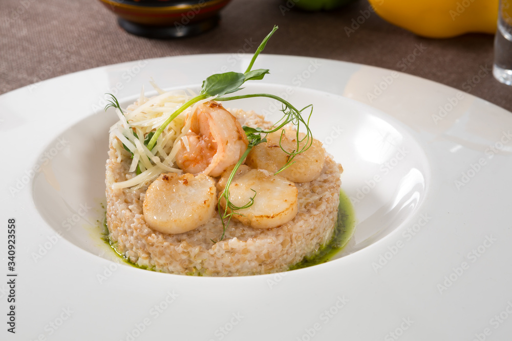 Scallops and shrimps with garnish Scallops and shrimps with garnish