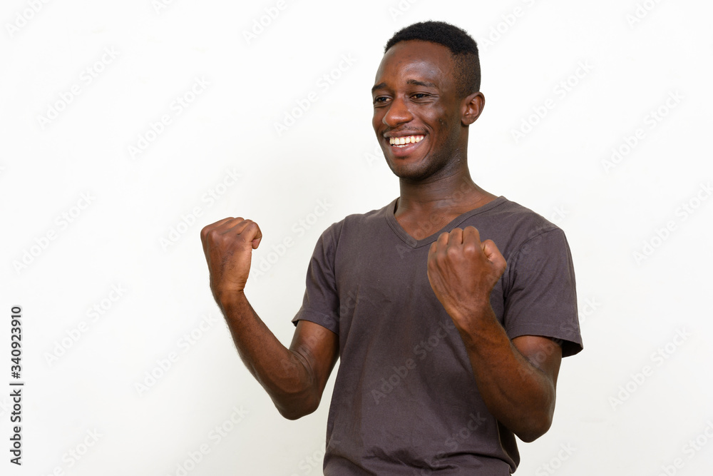 Portrait of happy young African man getting good news Portrait of happy young African man getting good news