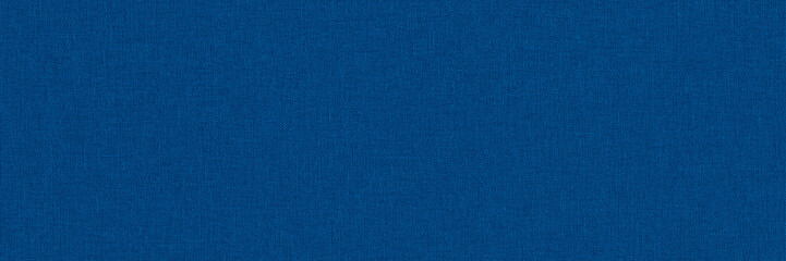 Close-up long and wide texture of natural blue fabric or cloth in light blue color. Fabric texture of natural cotton or linen textile material. Blue canvas background.