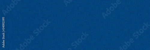 Close-up long and wide texture of natural blue fabric or cloth in light blue color. Fabric texture of natural cotton or linen textile material. Blue canvas background.