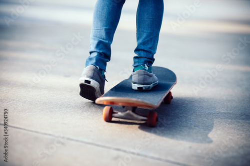 Skateboarder legs skateboarding at outdoors