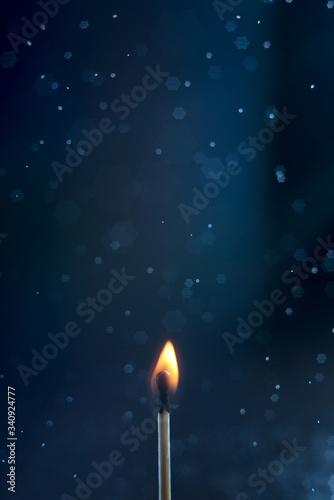 Burning matchstick on black background and it's smoke. Bokeh background