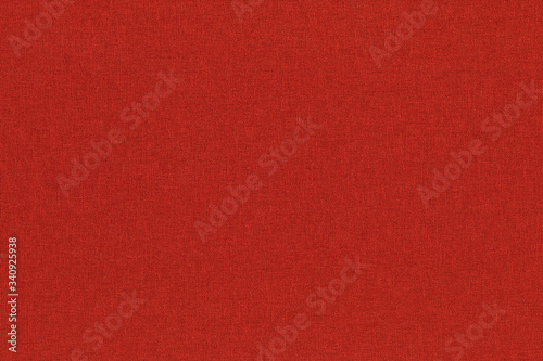 Close-up hight resolution texture of natural red fabric or cloth in light red color. Fabric texture of natural cotton or linen textile material. Red canvas background.