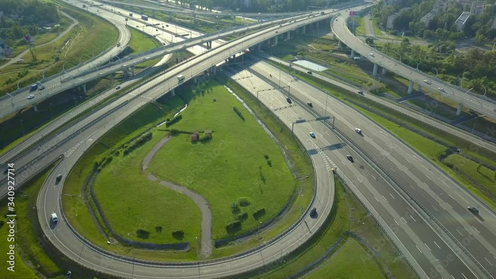 Aerial forward multi-level layered road junction beautiful Petersburg complex route. Traffic flow intersection. Many cars transportation high speed highway. Russia modern cityscape. Logistics Driving Aerial forward multi-level layered road junction beautiful Petersburg complex route. Traffic flow intersection. Many cars transportation high speed highway. Russia modern cityscape. Logistics Driving