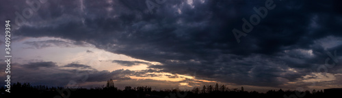The sky, the sun setting behind the clouds. © Омурали Тойчиев
