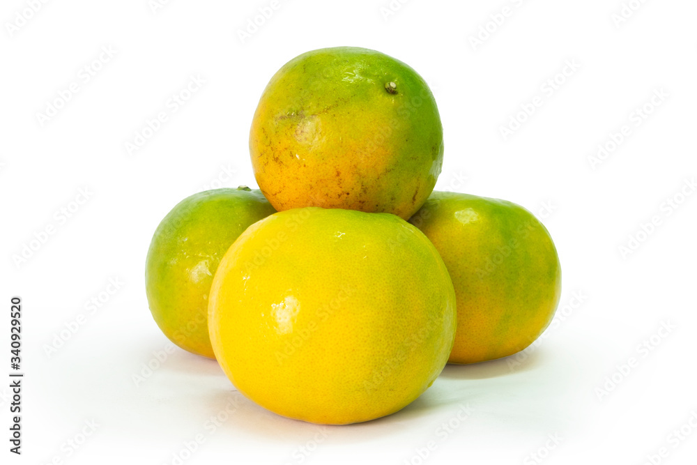 Fresh green tangerine on white background. selective focus, soft focus. Fresh green tangerine on white background. selective focus, soft focus.