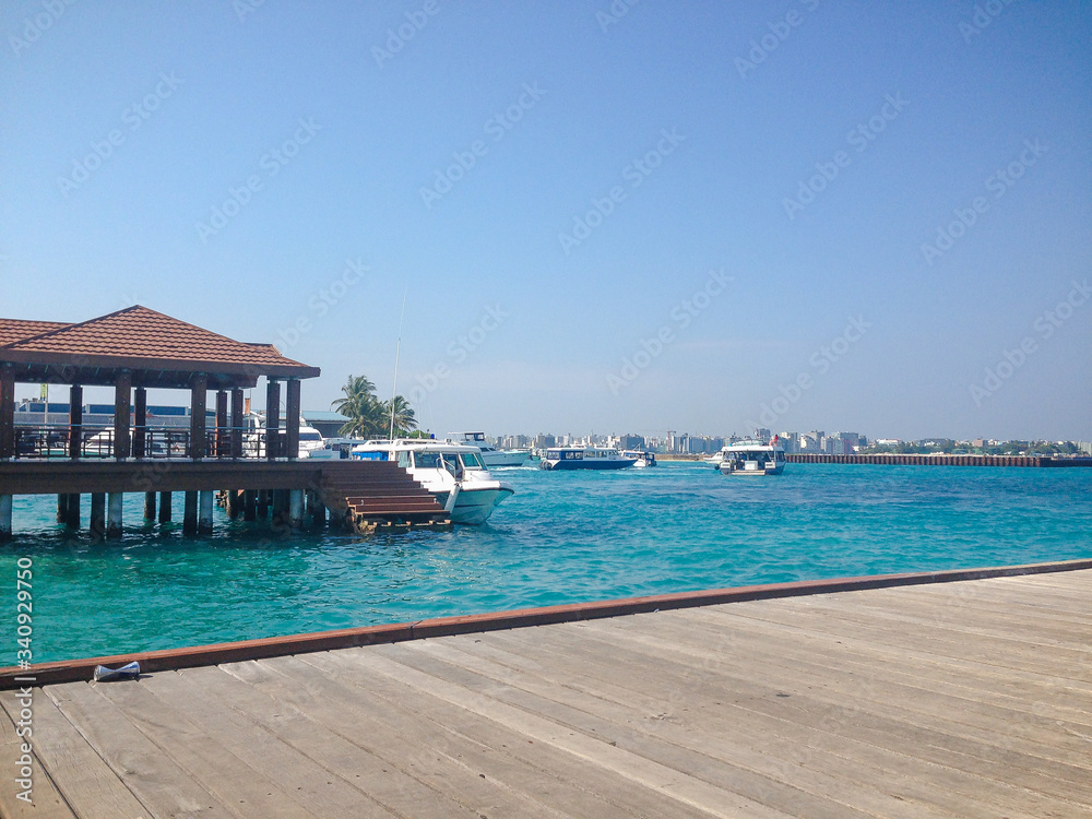 Male, Maldives ? February 10, 2017: Terminal of Male airport (MLE) in the Maldives. View from the pier to the beautiful sea and boats.