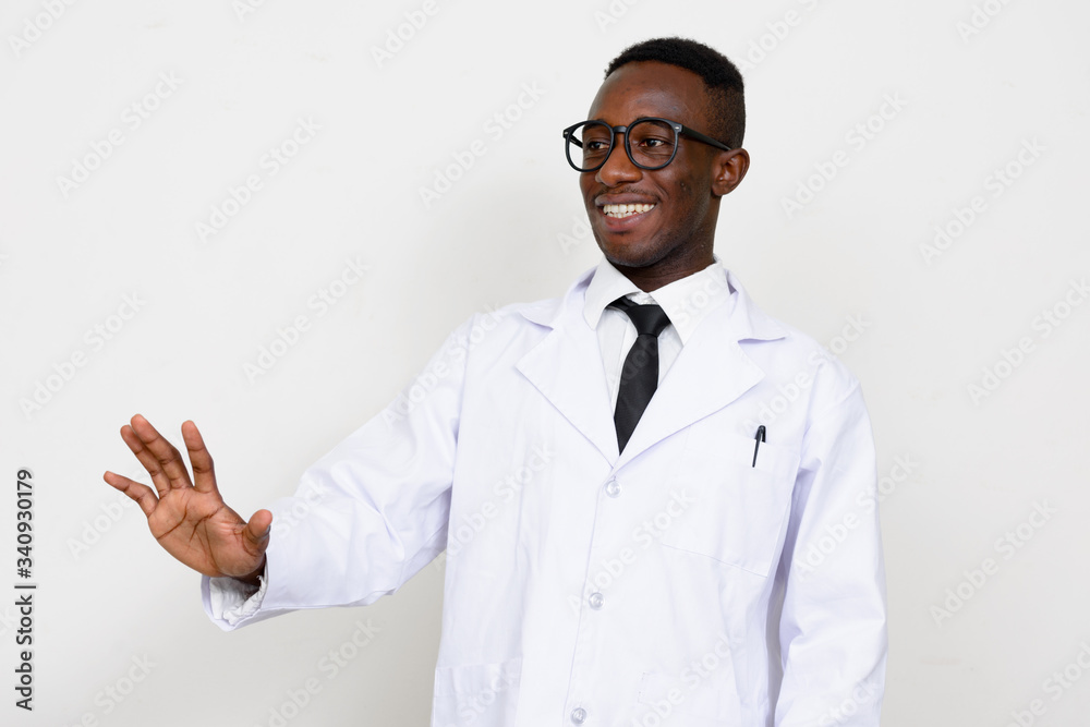 Portrait of happy young African man doctor gesturing Portrait of happy young African man doctor gesturing